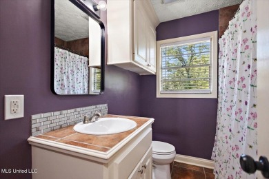 This charming 3-bedroom, 2-bath home, nestled in the heart of on Pearl Municipal Golf Course in Mississippi - for sale on GolfHomes.com, golf home, golf lot