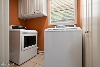 This charming 3-bedroom, 2-bath home, nestled in the heart of on Pearl Municipal Golf Course in Mississippi - for sale on GolfHomes.com, golf home, golf lot