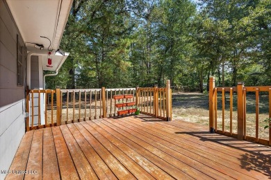 This charming 3-bedroom, 2-bath home, nestled in the heart of on Pearl Municipal Golf Course in Mississippi - for sale on GolfHomes.com, golf home, golf lot