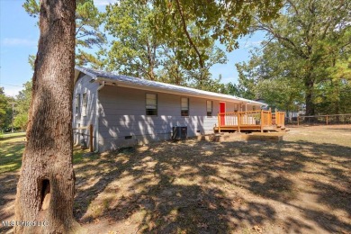 This charming 3-bedroom, 2-bath home, nestled in the heart of on Pearl Municipal Golf Course in Mississippi - for sale on GolfHomes.com, golf home, golf lot