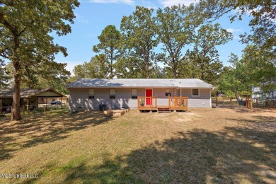 This charming 3-bedroom, 2-bath home, nestled in the heart of on Pearl Municipal Golf Course in Mississippi - for sale on GolfHomes.com, golf home, golf lot