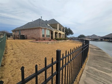 Water's Edge perfection with 132 ft of water frontage on a quiet on Harbor Lakes Golf Club in Texas - for sale on GolfHomes.com, golf home, golf lot