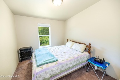 100 feet of Lamb Creek frontage in a peaceful, private setting on Priest Lake Golf and Tennis Club in Idaho - for sale on GolfHomes.com, golf home, golf lot