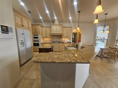 Water's Edge perfection with 132 ft of water frontage on a quiet on Harbor Lakes Golf Club in Texas - for sale on GolfHomes.com, golf home, golf lot