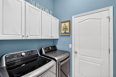 This beautifully maintained home offers exceptional privacy on Ritz-Carlton Members Golf Club in Florida - for sale on GolfHomes.com, golf home, golf lot