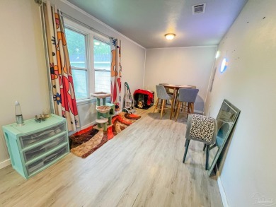 This quaint country cottage-style gem offers the perfect canvas on Champion Golf Club in Florida - for sale on GolfHomes.com, golf home, golf lot