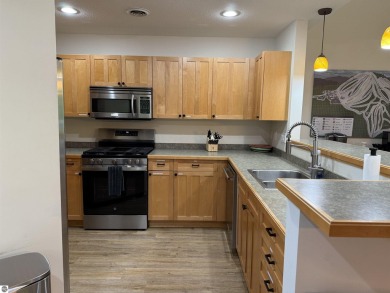 Ski-In/Ski-Out Shanty Creek Condo Overlooking the 18th Green - on Cedar River Golf Course in Michigan - for sale on GolfHomes.com, golf home, golf lot