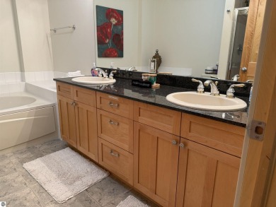 Ski-In/Ski-Out Shanty Creek Condo Overlooking the 18th Green - on Cedar River Golf Course in Michigan - for sale on GolfHomes.com, golf home, golf lot