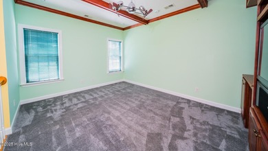 Stunning Golf Course Custom Home in Brunswick Plantation - on Brunswick Plantation and Golf Resorts in North Carolina - for sale on GolfHomes.com, golf home, golf lot