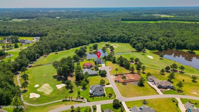 Stunning Golf Course Custom Home in Brunswick Plantation - on Brunswick Plantation and Golf Resorts in North Carolina - for sale on GolfHomes.com, golf home, golf lot