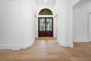 Enter through the massive double doors and into this completely on West Bay Beach and Golf Club in Florida - for sale on GolfHomes.com, golf home, golf lot