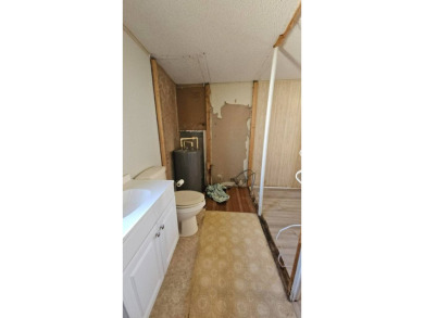 Cute 2 bedroom 2 bath home with newer flooring and is partially on Golden Lakes Golf Course in Florida - for sale on GolfHomes.com, golf home, golf lot