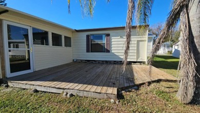 Cute 2 bedroom 2 bath home with newer flooring and is partially on Golden Lakes Golf Course in Florida - for sale on GolfHomes.com, golf home, golf lot