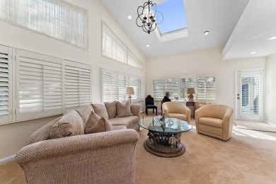 Enjoy golf and water views from this charming one-story on Delray Dunes Golf and Country Club in Florida - for sale on GolfHomes.com, golf home, golf lot