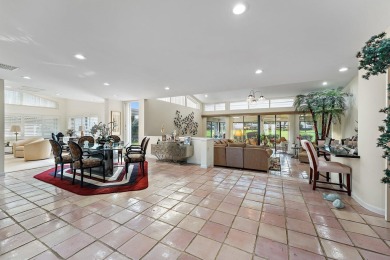 Enjoy golf and water views from this charming one-story on Delray Dunes Golf and Country Club in Florida - for sale on GolfHomes.com, golf home, golf lot