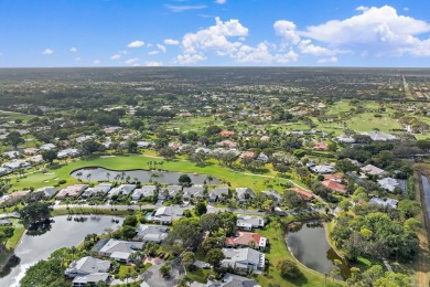 Enjoy golf and water views from this charming one-story on Delray Dunes Golf and Country Club in Florida - for sale on GolfHomes.com, golf home, golf lot