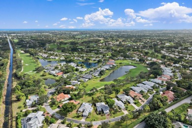 Enjoy golf and water views from this charming one-story on Delray Dunes Golf and Country Club in Florida - for sale on GolfHomes.com, golf home, golf lot