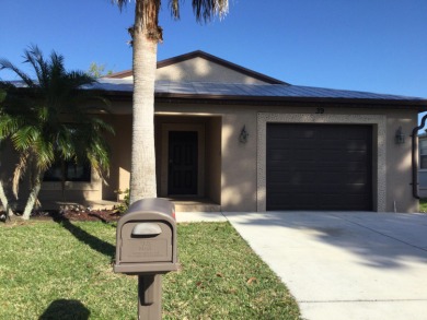 Well maintained 2017 Carlton Model that backs to the canal on Spanish Lakes I in Florida - for sale on GolfHomes.com, golf home, golf lot