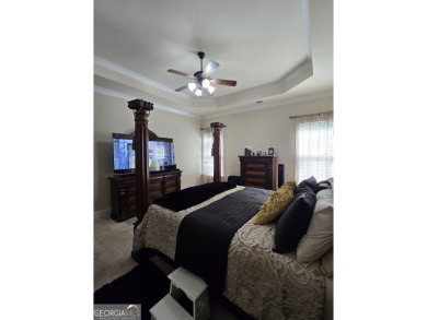 MOTIVATED SELLERS!  ENJOY LUXURIOUS LIVING IN THE HERON BAY on Canongate At Heron Bay in Georgia - for sale on GolfHomes.com, golf home, golf lot