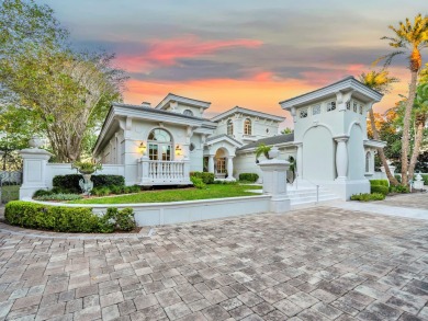 This stunning Waterfront Bay Estate is a rare gem nestled within on Kelly Plantation Golf Club in Florida - for sale on GolfHomes.com, golf home, golf lot