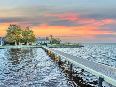 This stunning Waterfront Bay Estate is a rare gem nestled within on Kelly Plantation Golf Club in Florida - for sale on GolfHomes.com, golf home, golf lot