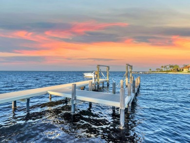 This stunning Waterfront Bay Estate is a rare gem nestled within on Kelly Plantation Golf Club in Florida - for sale on GolfHomes.com, golf home, golf lot