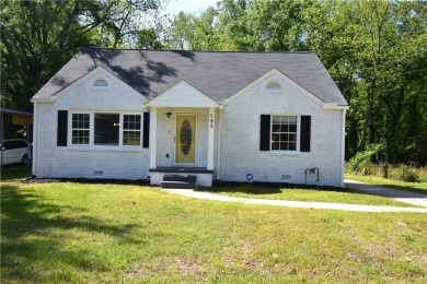 This beautiful brick bungalow style home has been recently on Browns Mill Golf Course in Georgia - for sale on GolfHomes.com, golf home, golf lot