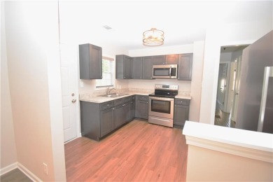 This beautiful brick bungalow style home has been recently on Browns Mill Golf Course in Georgia - for sale on GolfHomes.com, golf home, golf lot