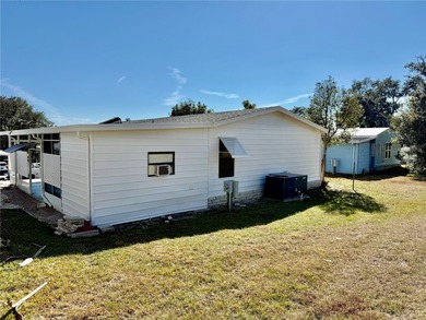 Move-in ready and full of charm, this 2-bedroom, 2-bath home is on Zellwood Station Country Club in Florida - for sale on GolfHomes.com, golf home, golf lot