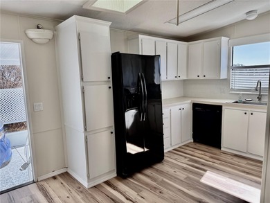 Move-in ready and beautifully refreshed, this 2-bedroom, 2-bath on Zellwood Station Country Club in Florida - for sale on GolfHomes.com, golf home, golf lot