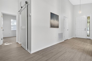 One or more photo(s) has been virtually stagedpletely Remodeled on Sanctuary Ridge Golf in Florida - for sale on GolfHomes.com, golf home, golf lot