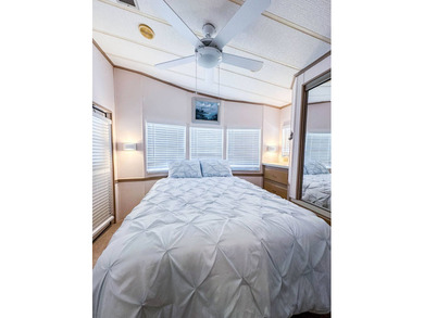 Enjoy your winters in sunny Florida or experience full time on The Great Outdoors Golf and Country Club in Florida - for sale on GolfHomes.com, golf home, golf lot