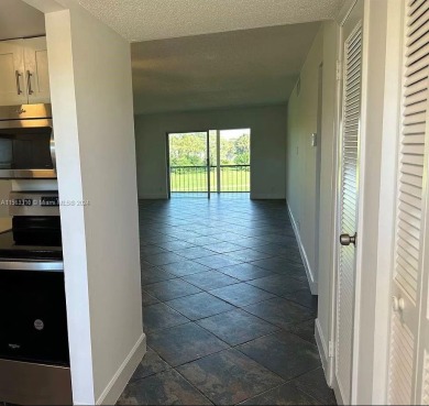 Welcome to your serene sanctuary in the gated community of on Inverrary Country Club in Florida - for sale on GolfHomes.com, golf home, golf lot