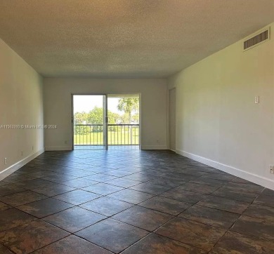 Welcome to your serene sanctuary in the gated community of on Inverrary Country Club in Florida - for sale on GolfHomes.com, golf home, golf lot