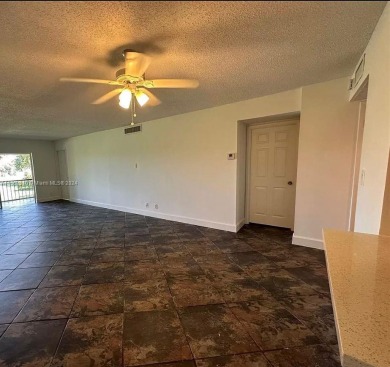 Welcome to your serene sanctuary in the gated community of on Inverrary Country Club in Florida - for sale on GolfHomes.com, golf home, golf lot