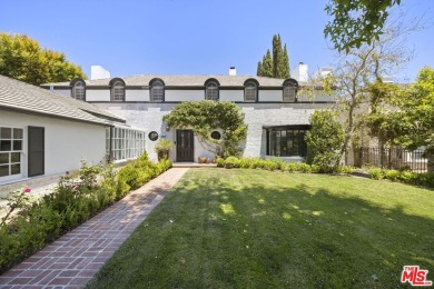 Tucked behind lush landscaping on one of the most coveted and on Los Angeles Country Club in California - for sale on GolfHomes.com, golf home, golf lot