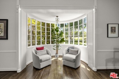 Tucked behind lush landscaping on one of the most coveted and on Los Angeles Country Club in California - for sale on GolfHomes.com, golf home, golf lot