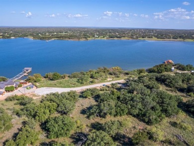 Build your lakeside retreat on this elevated 0.3-acre lot within on Hideout Golf Club and Resort  in Texas - for sale on GolfHomes.com, golf home, golf lot