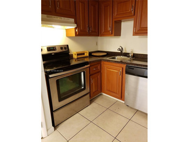 Split level 2 bedroom, 2 bath. Washer Dryer in the unit. Large on Inverrary Country Club in Florida - for sale on GolfHomes.com, golf home, golf lot