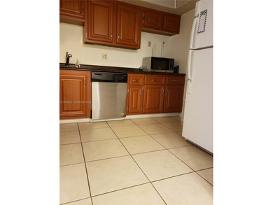 Split level 2 bedroom, 2 bath. Washer Dryer in the unit. Large on Inverrary Country Club in Florida - for sale on GolfHomes.com, golf home, golf lot