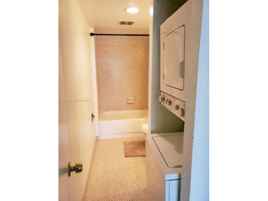 Split level 2 bedroom, 2 bath. Washer Dryer in the unit. Large on Inverrary Country Club in Florida - for sale on GolfHomes.com, golf home, golf lot