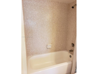 Split level 2 bedroom, 2 bath. Washer Dryer in the unit. Large on Inverrary Country Club in Florida - for sale on GolfHomes.com, golf home, golf lot