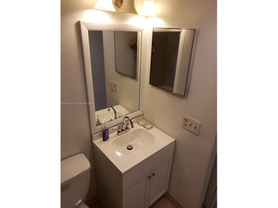 Split level 2 bedroom, 2 bath. Washer Dryer in the unit. Large on Inverrary Country Club in Florida - for sale on GolfHomes.com, golf home, golf lot