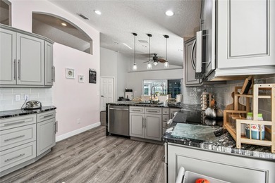 Welcome to a home where luxury meets ease... and where every day on Kings Ridge Golf Club in Florida - for sale on GolfHomes.com, golf home, golf lot