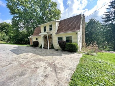 Here is a lovely 3 bedroom, 2 full bath, colonial style home on Mark Twain Golf Course in New York - for sale on GolfHomes.com, golf home, golf lot