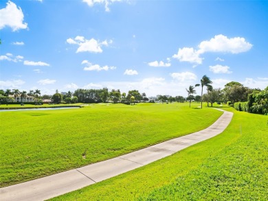 Experience golf course living at its finest in this beautifully on  in Florida - for sale on GolfHomes.com, golf home, golf lot
