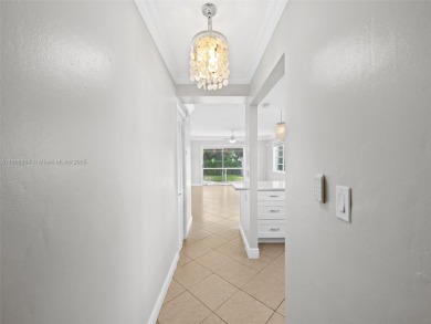 Experience golf course living at its finest in this beautifully on  in Florida - for sale on GolfHomes.com, golf home, golf lot