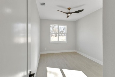 Nestled between Cedar Creek Country Club (golf packages on Cedar Creek Country Club in Texas - for sale on GolfHomes.com, golf home, golf lot