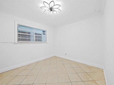 Experience golf course living at its finest in this beautifully on  in Florida - for sale on GolfHomes.com, golf home, golf lot
