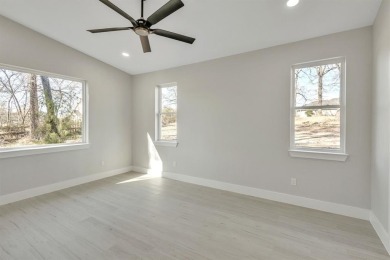 Nestled between Cedar Creek Country Club (golf packages on Cedar Creek Country Club in Texas - for sale on GolfHomes.com, golf home, golf lot